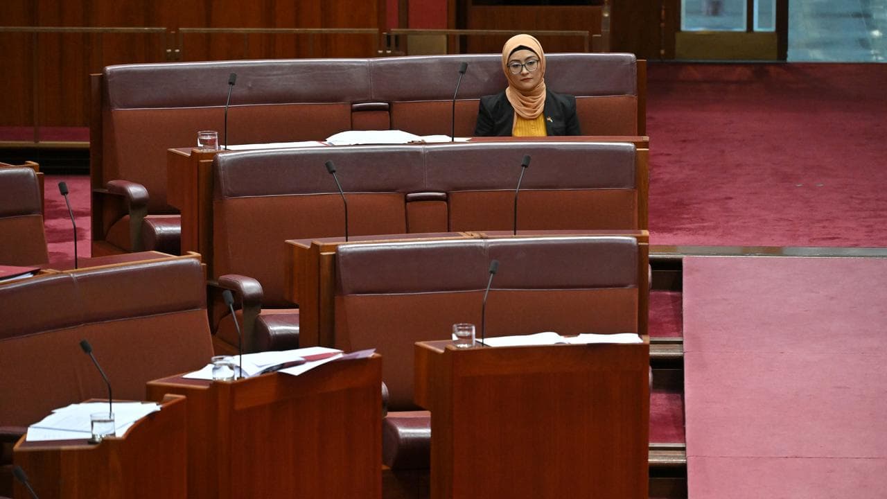 Senator Fatima Payman sits on the crossbench during Question Time.