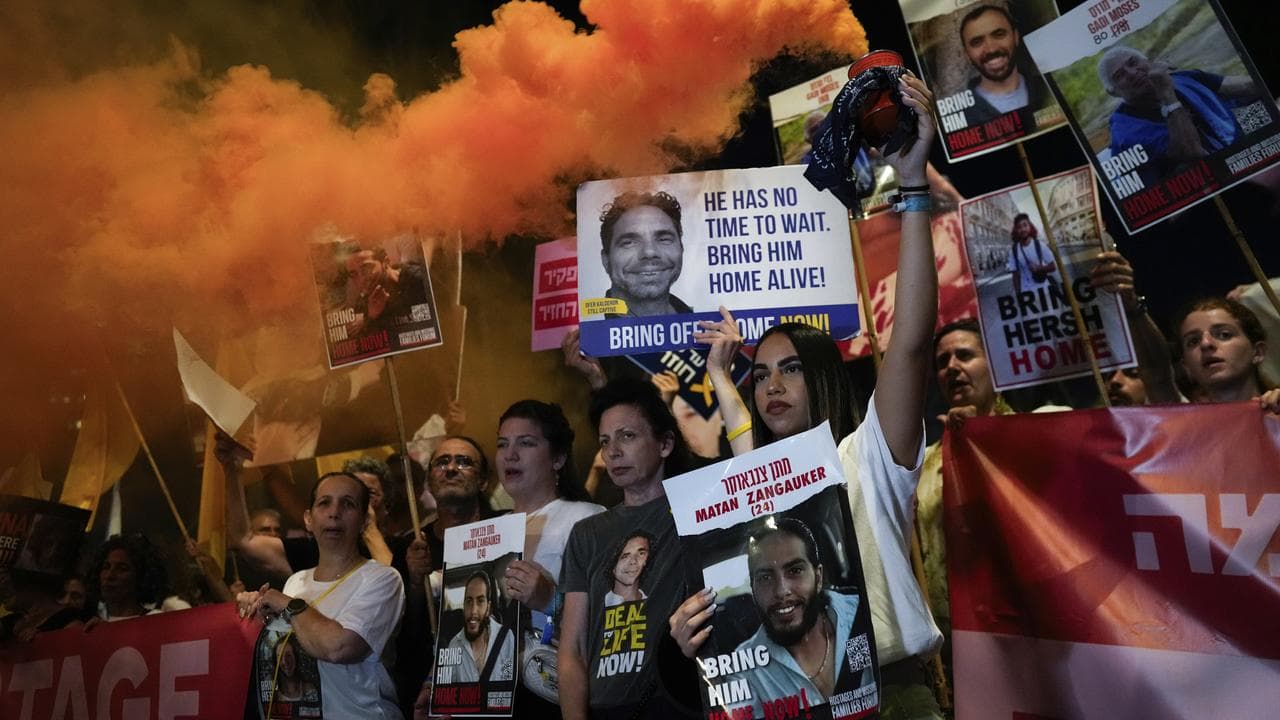 Relatives and friends of hostages held in Gaza at a rally in Tel Aviv