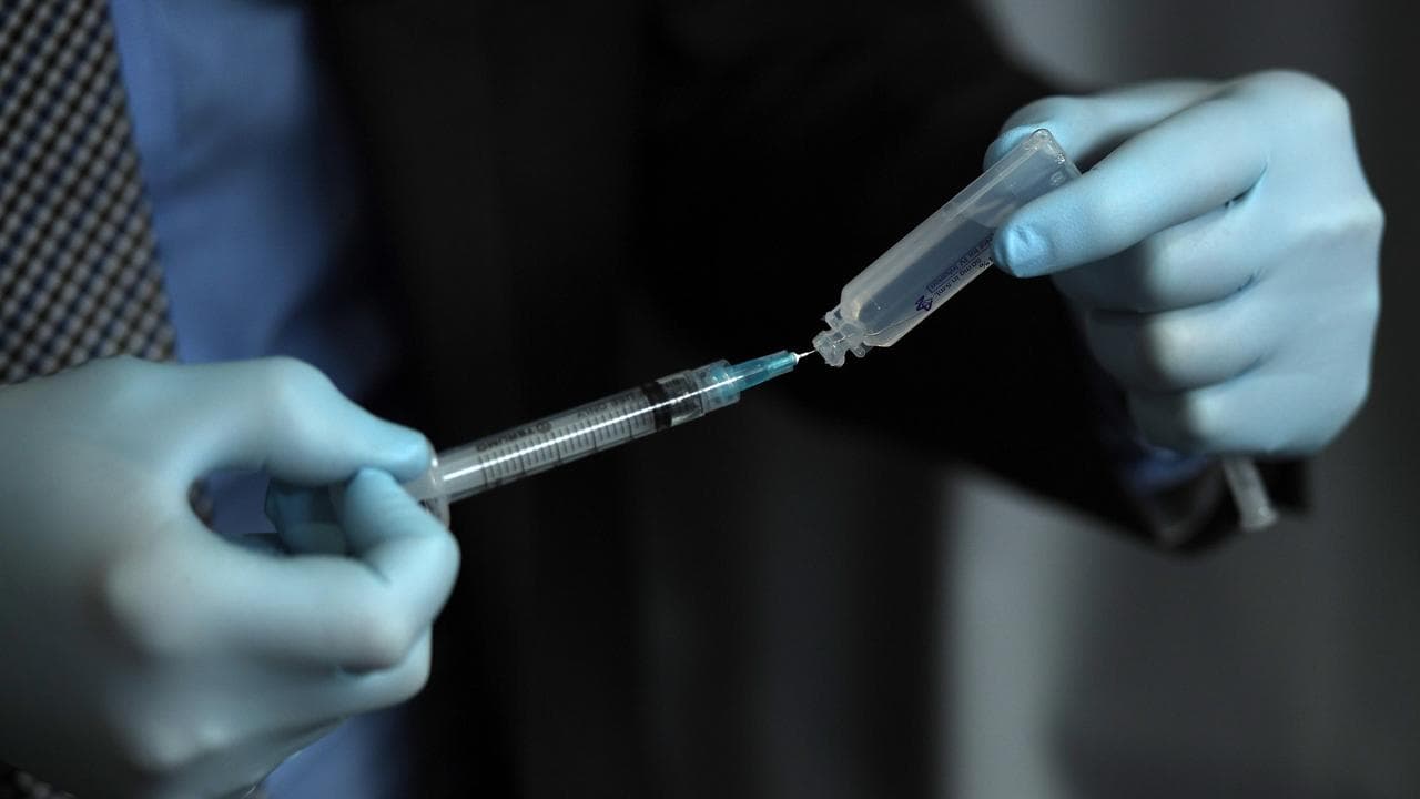 Doctor prepares injection