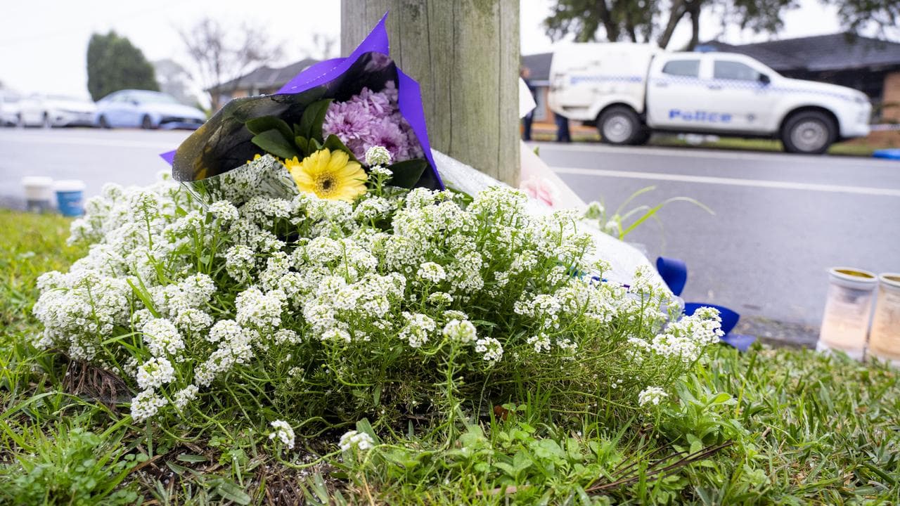 Tributes at the site a fatal house fire in Sydney's west