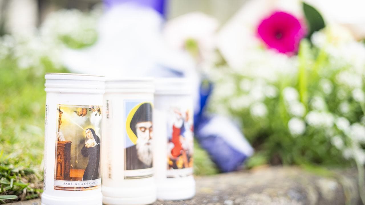 Tributes have been laid at the site of a fatal house fire in Sydney