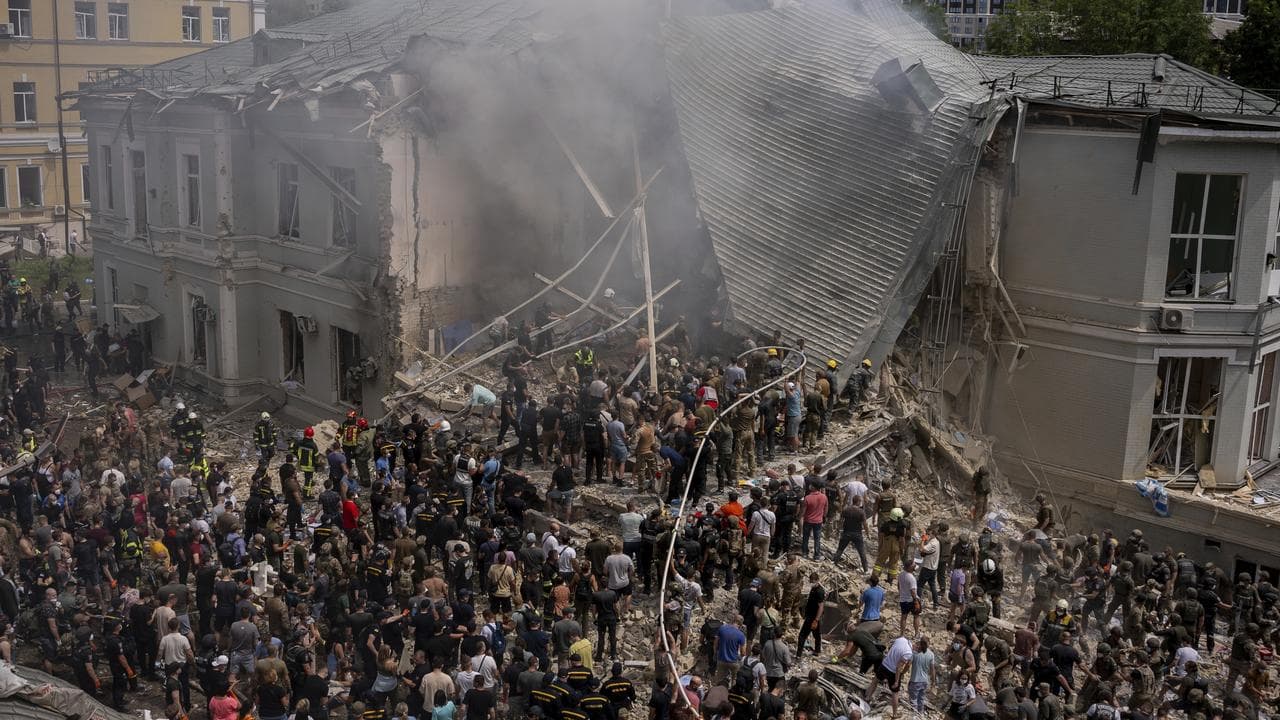Emergency workers at the site of Okhmatdyt children's hospital