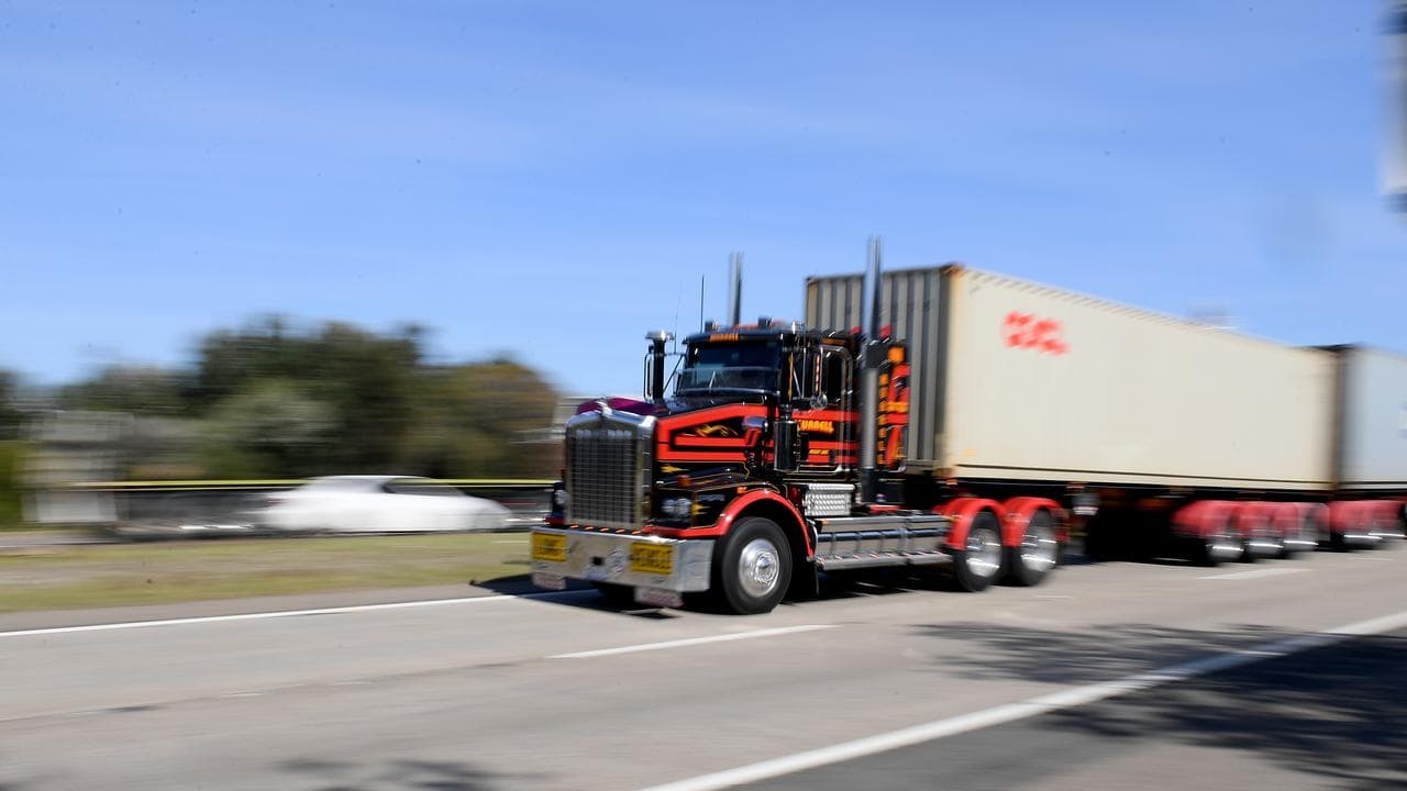 Trucks carrying shipping containers near Port Botany in Sydney