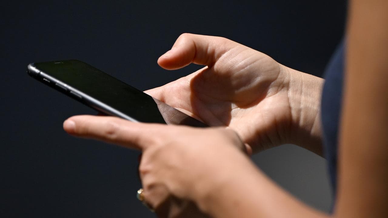 A woman using a smartphone.