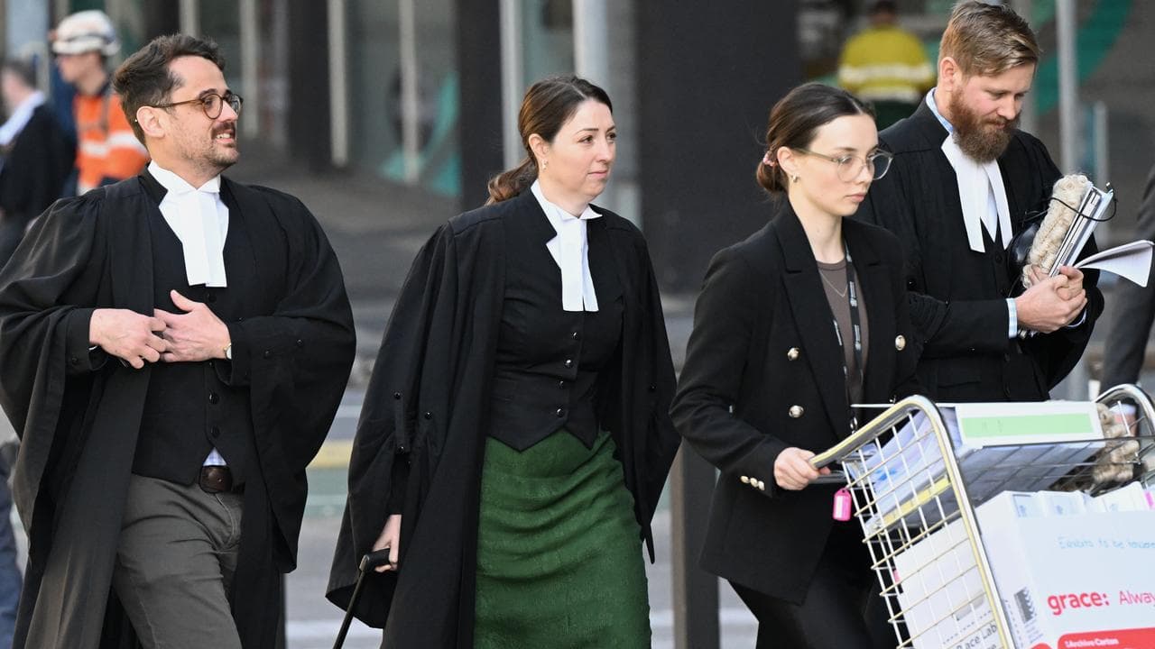 Prosecutor Caroline Marco (centre) arrives at Brisbane Supreme Court