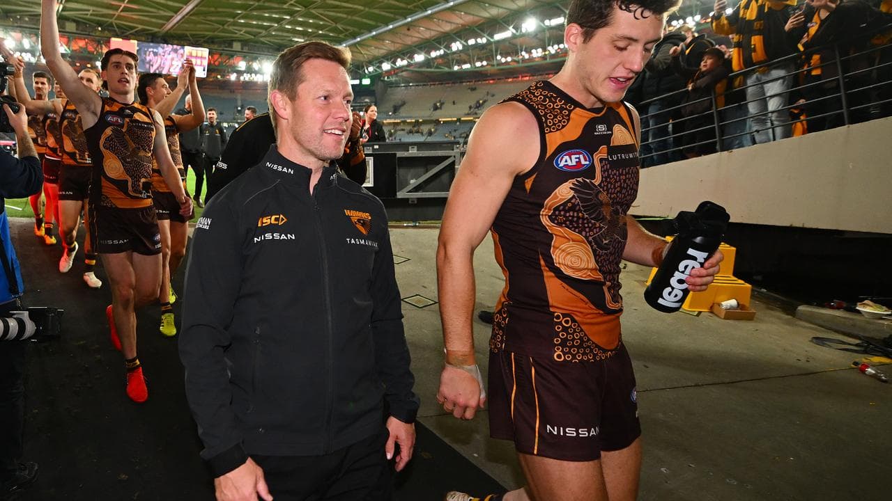 Hawthorn coach Sam Mitchell (second right).
