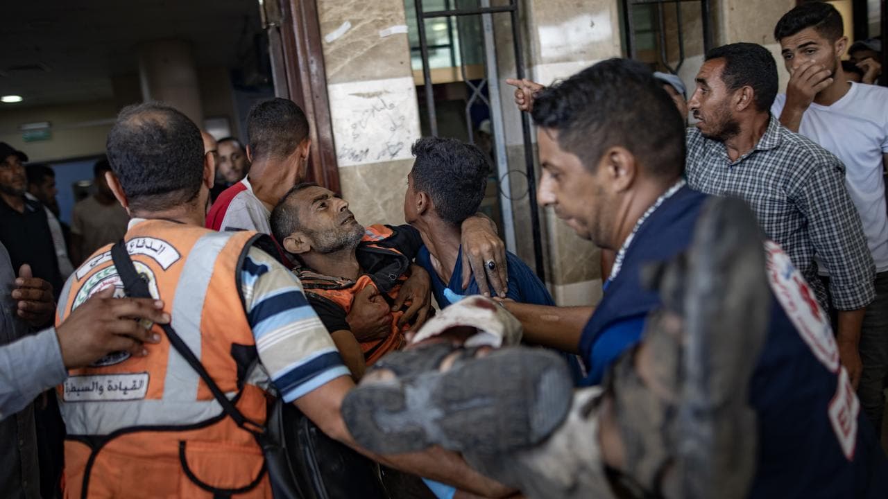 A man is taken to Nasser Hospital after an Israeli raid in Khan Younis