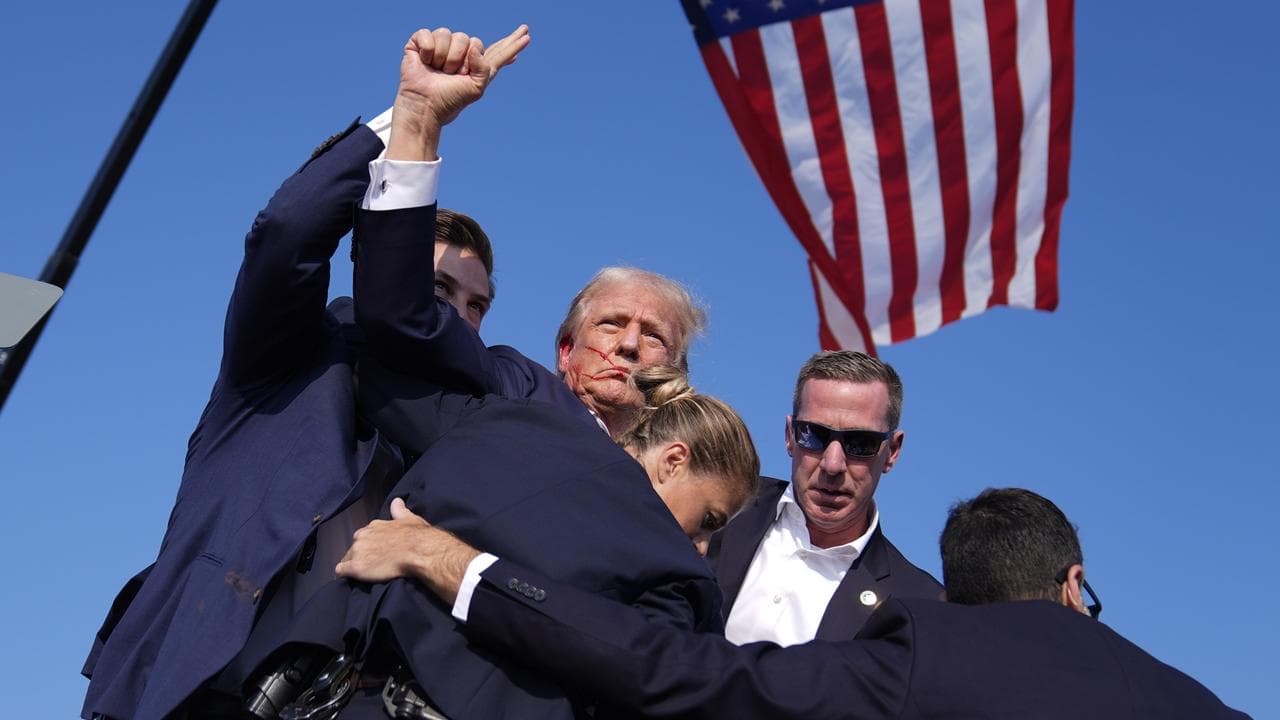 Donald Trump surrounded by security