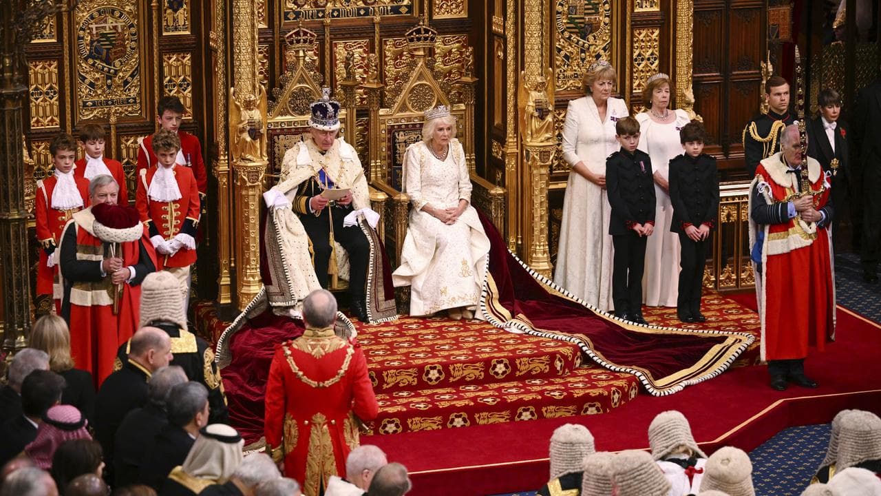 Britain's King Charles III next to Queen Camilla