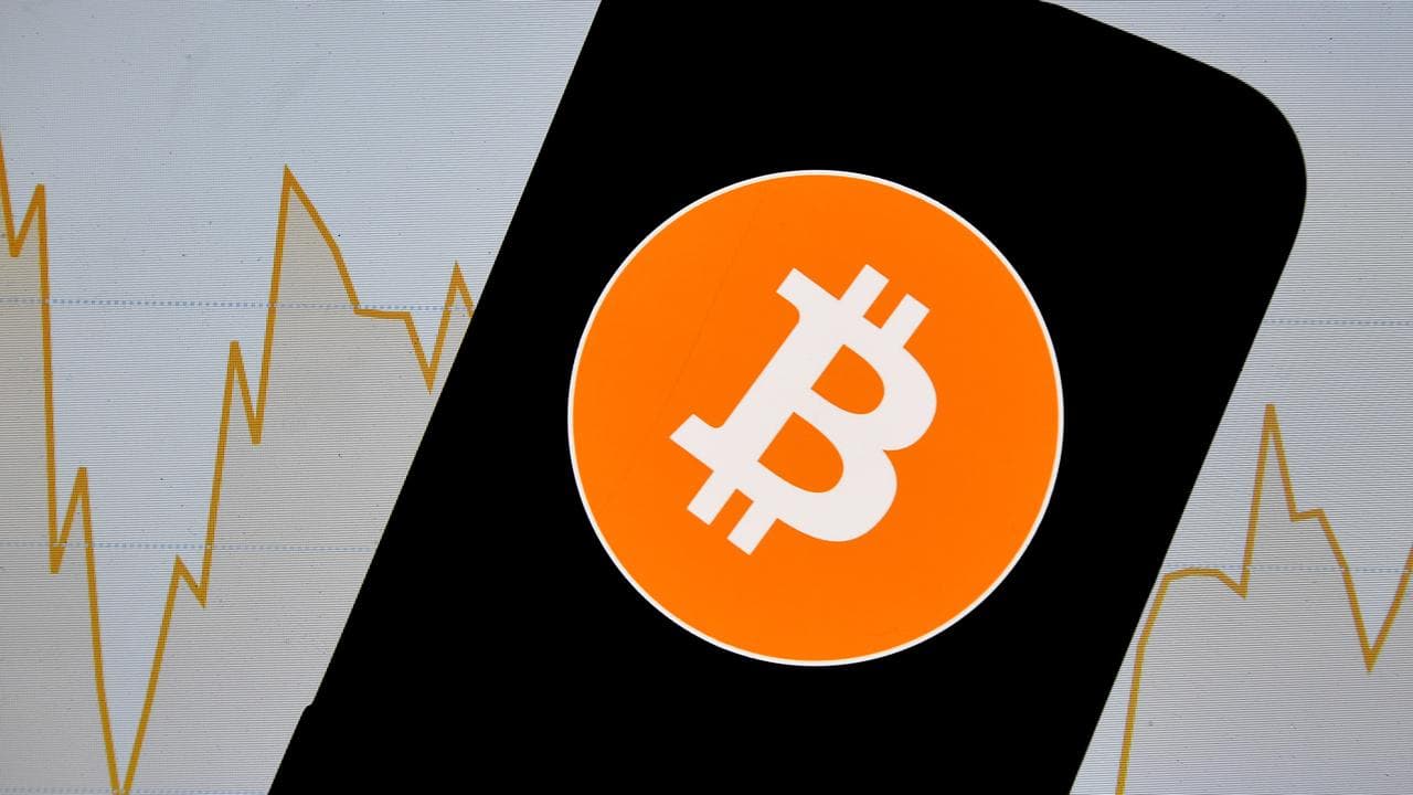 A bitcoin logo seen on a smartphone in Sydney