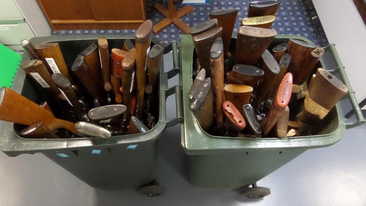 Guns in bins after being handed in to Tasmanian police.