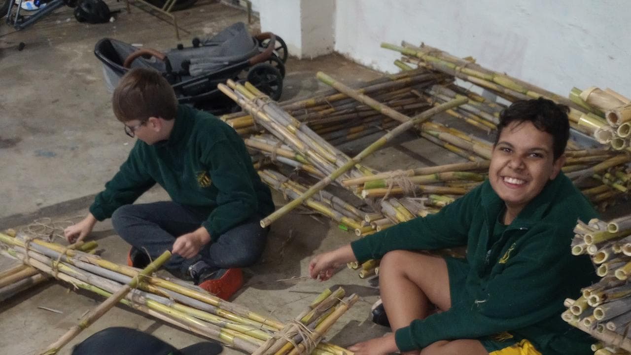 Boys to the Bush program participants helping make rafts