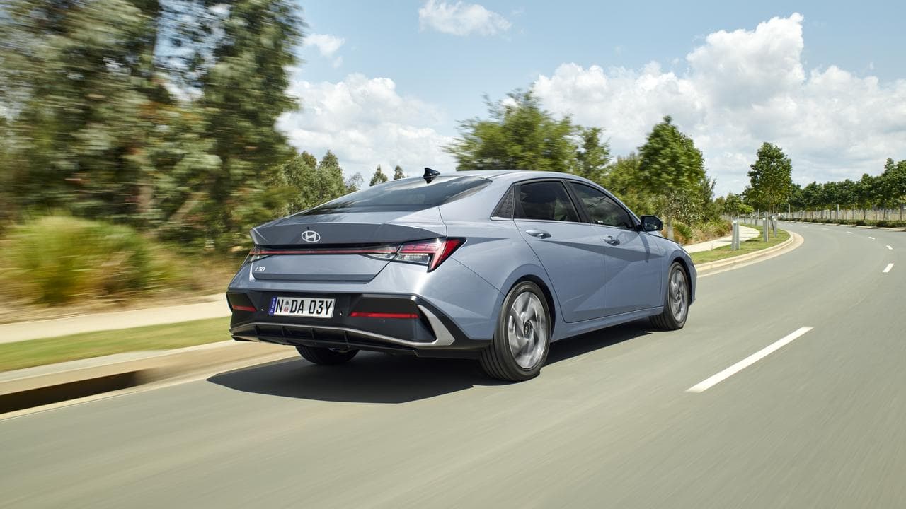 A Hyundai drives on a rad.