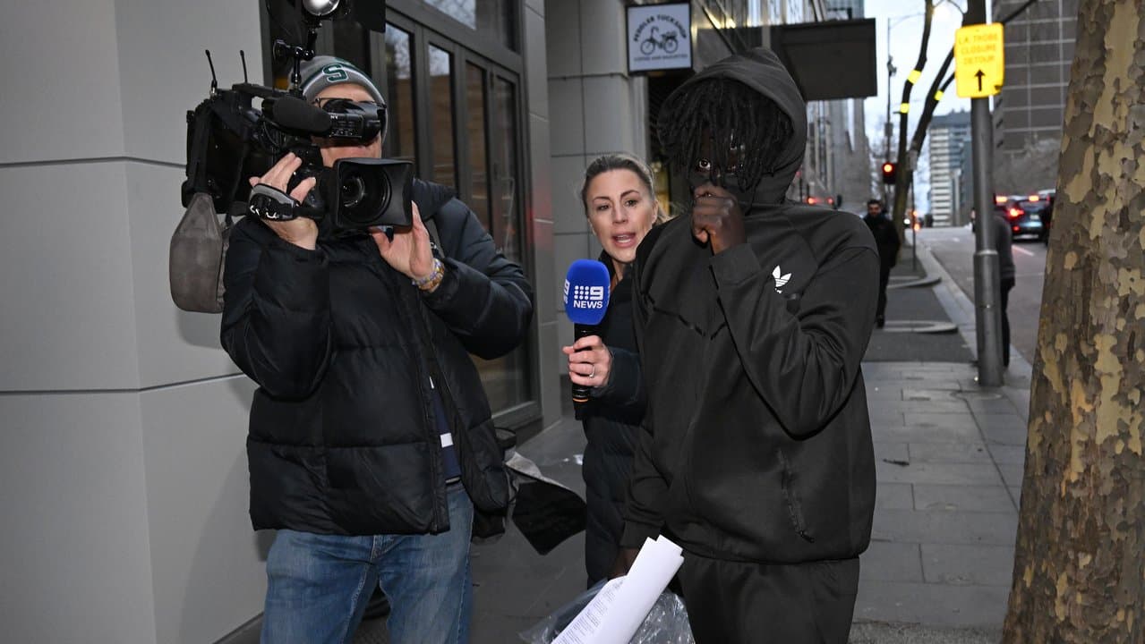 Atem Thon (right) departs from the Melbourne Magistrates Court