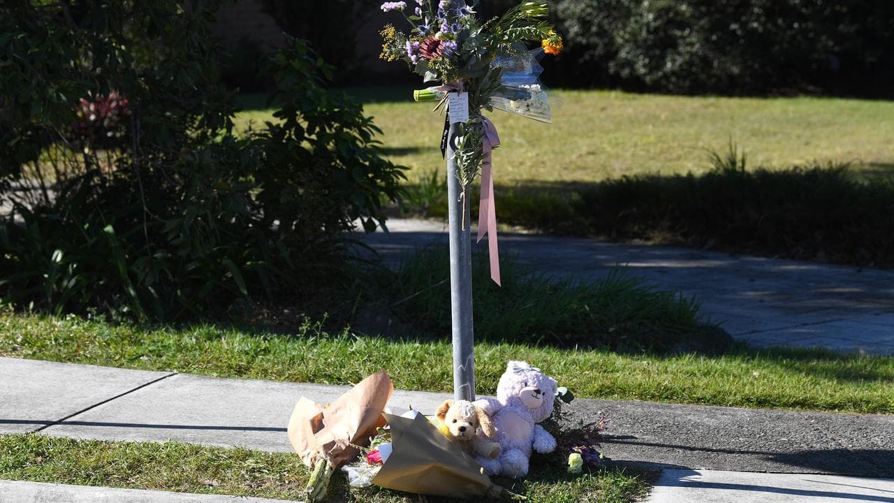 Floral tributes at the site of a pedestrian hit-and-run in Daisy Hill