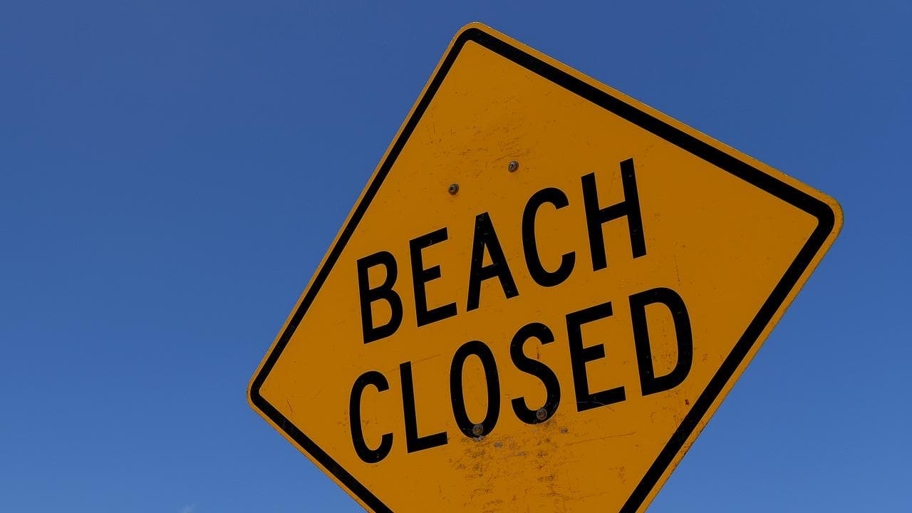 Beach closed sign