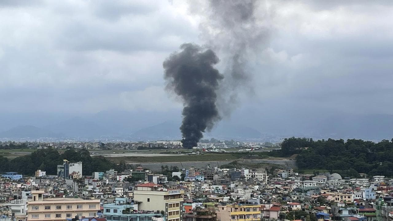 Smoke rises from the Tribhuvan International Airport in Kathmandu