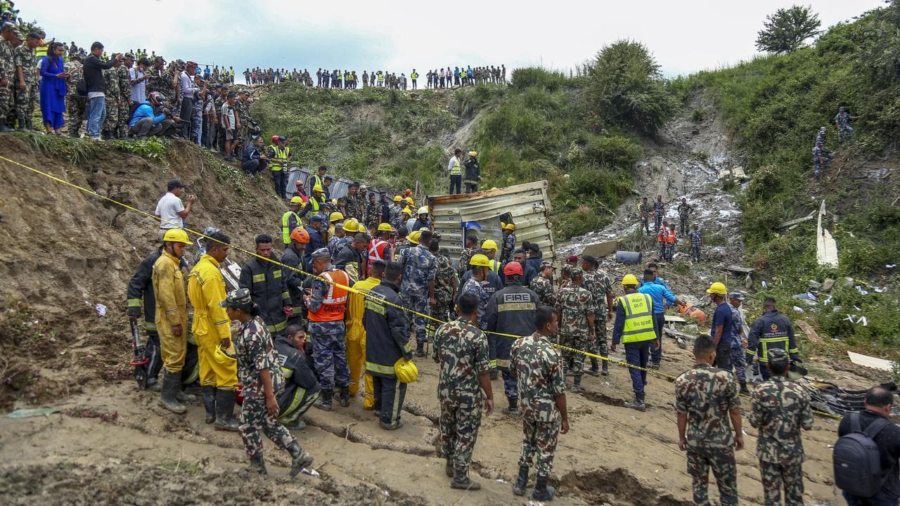 Army personnel at a plane crash site at the Kathmandu airport