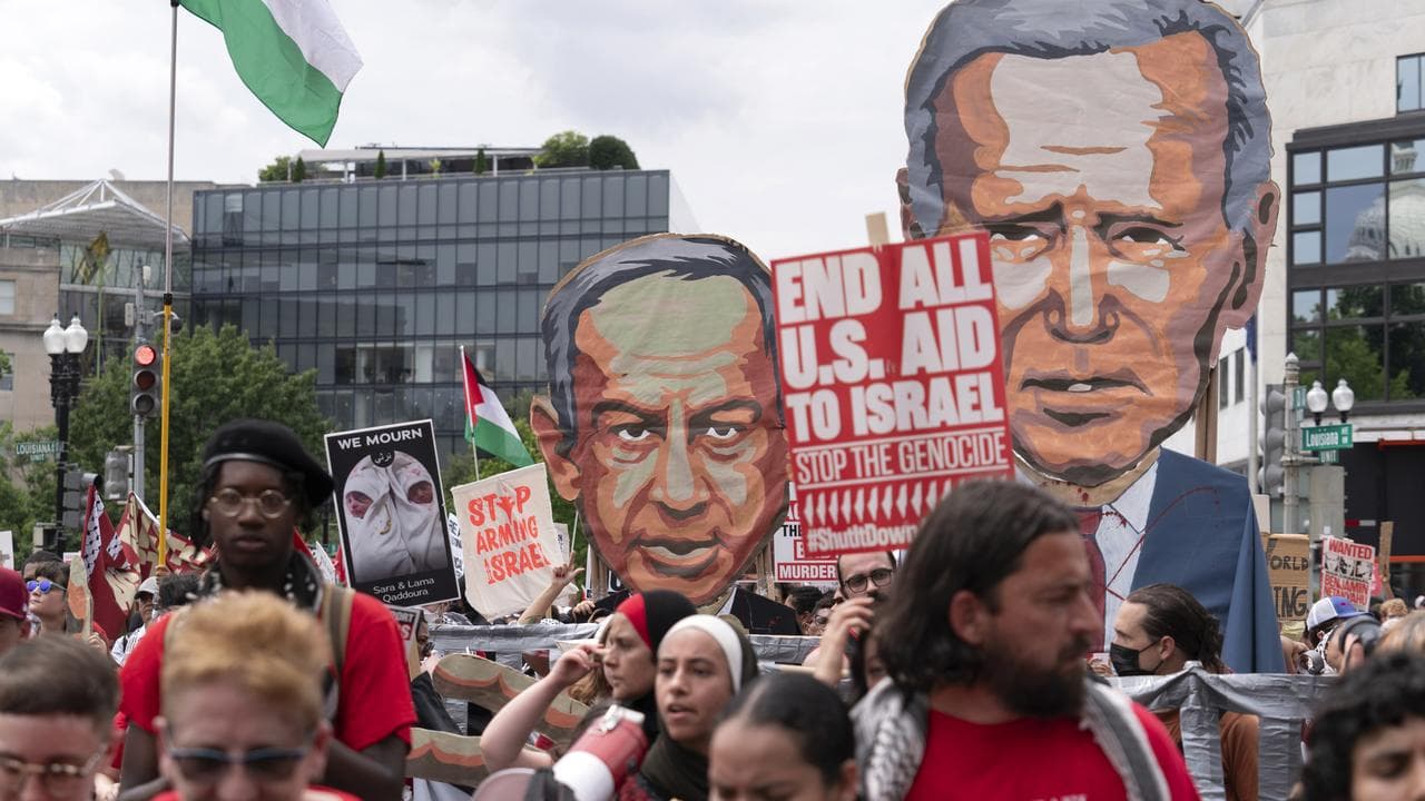 Anti-Netanyahu demonstrators march outside of the US Capitol