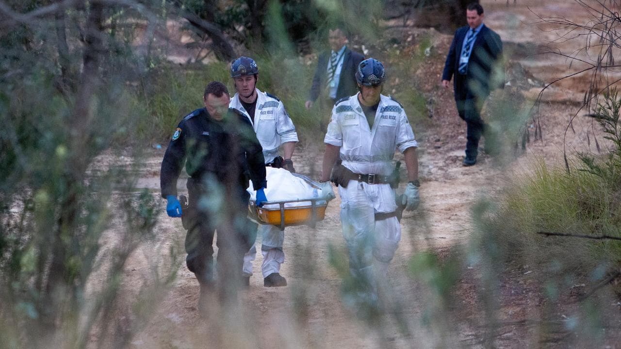 Police recovering the body at Sandy Point (file image)