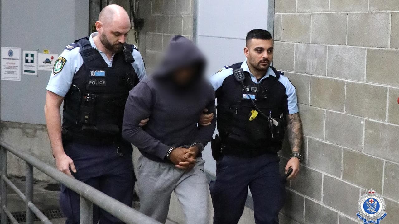 A man in the being taken into custody