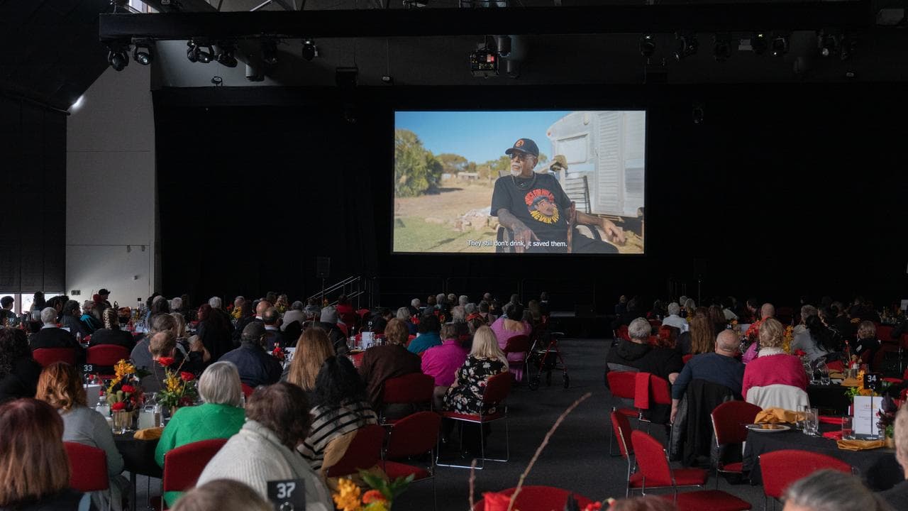 People watch a movie.