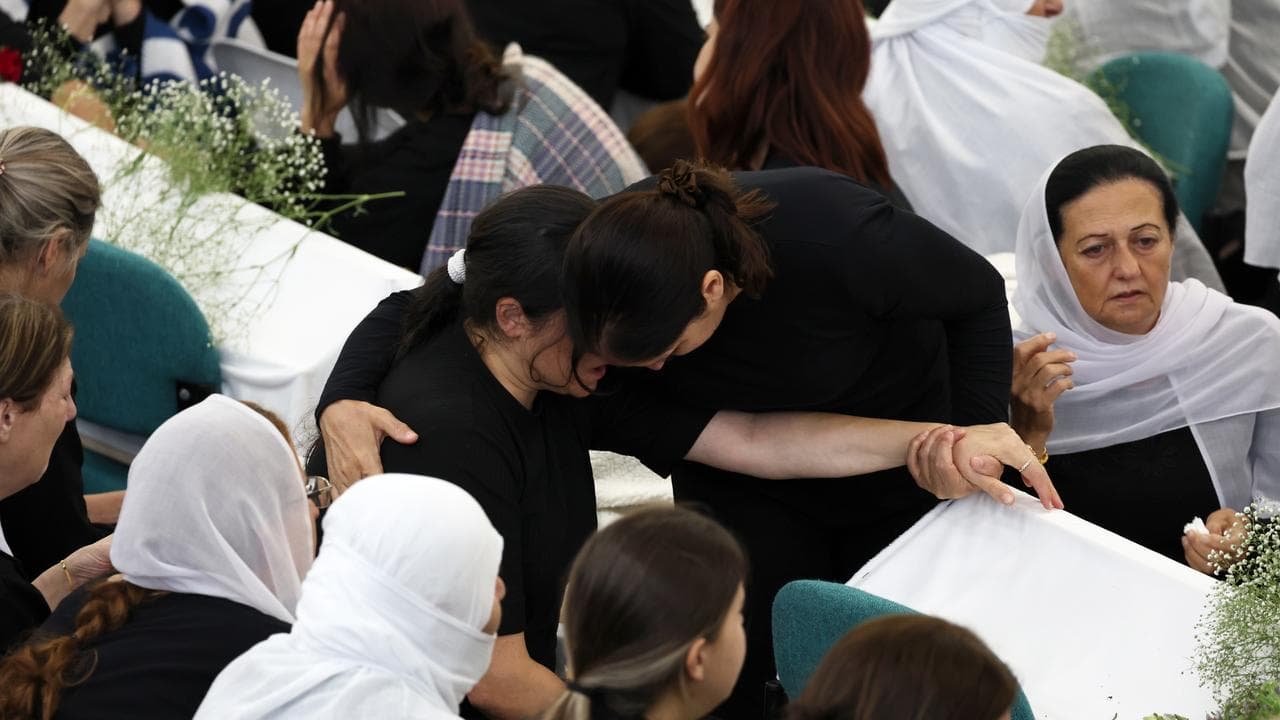 Relatives at funerals in Majdal Shams