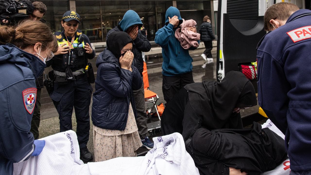 Sakina Muhammad Jan’s supporter is treated by paramedics