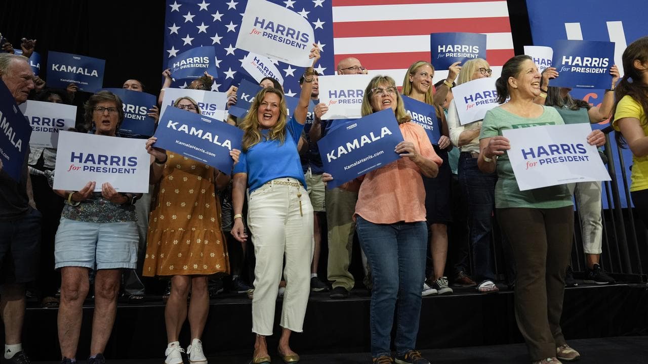 Attendees cheer during a campaign event 
