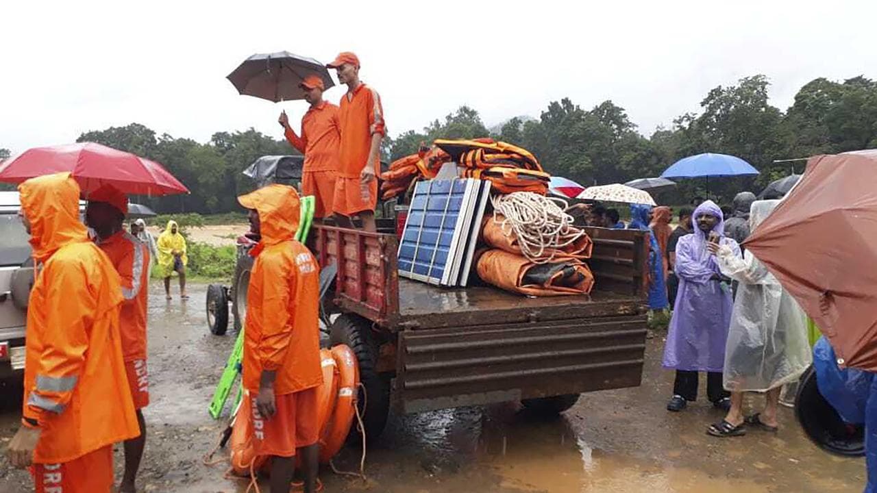 Rescuers after a landslide in Wayanad, southern Kerala state, India,