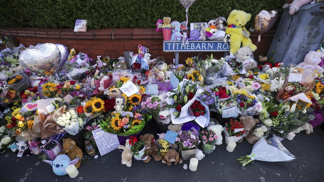 Tributes on a footpath for the victims of the Southport stabbing