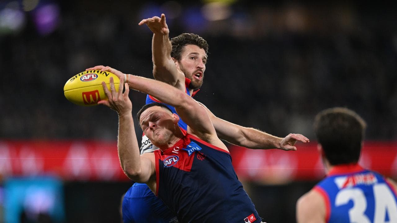 Demon Steven May and Bulldog Marcus Bontempelli compete for the ball.