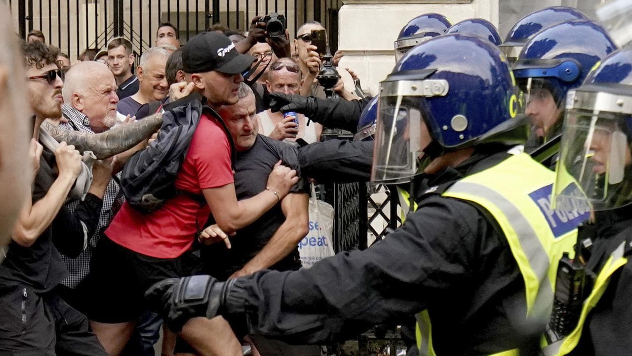 Protesters scuffle with police in Whitehall, London