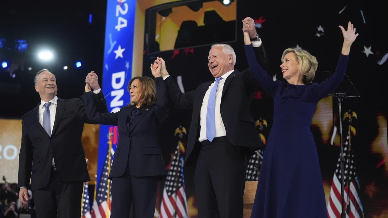 Doug Emhoff, Kamala Harris, Tim Walz and Gwen Walz on stage at the DNC