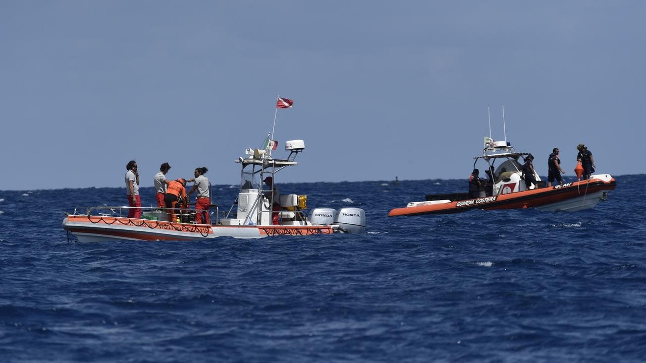 Emergency boats and crew off Porticello in southern Italy