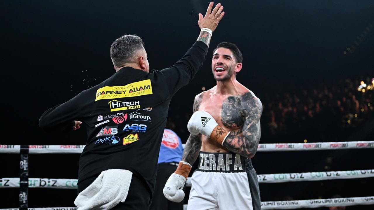 Trainer Tommy Mercuri runs towards Michael Zerafa