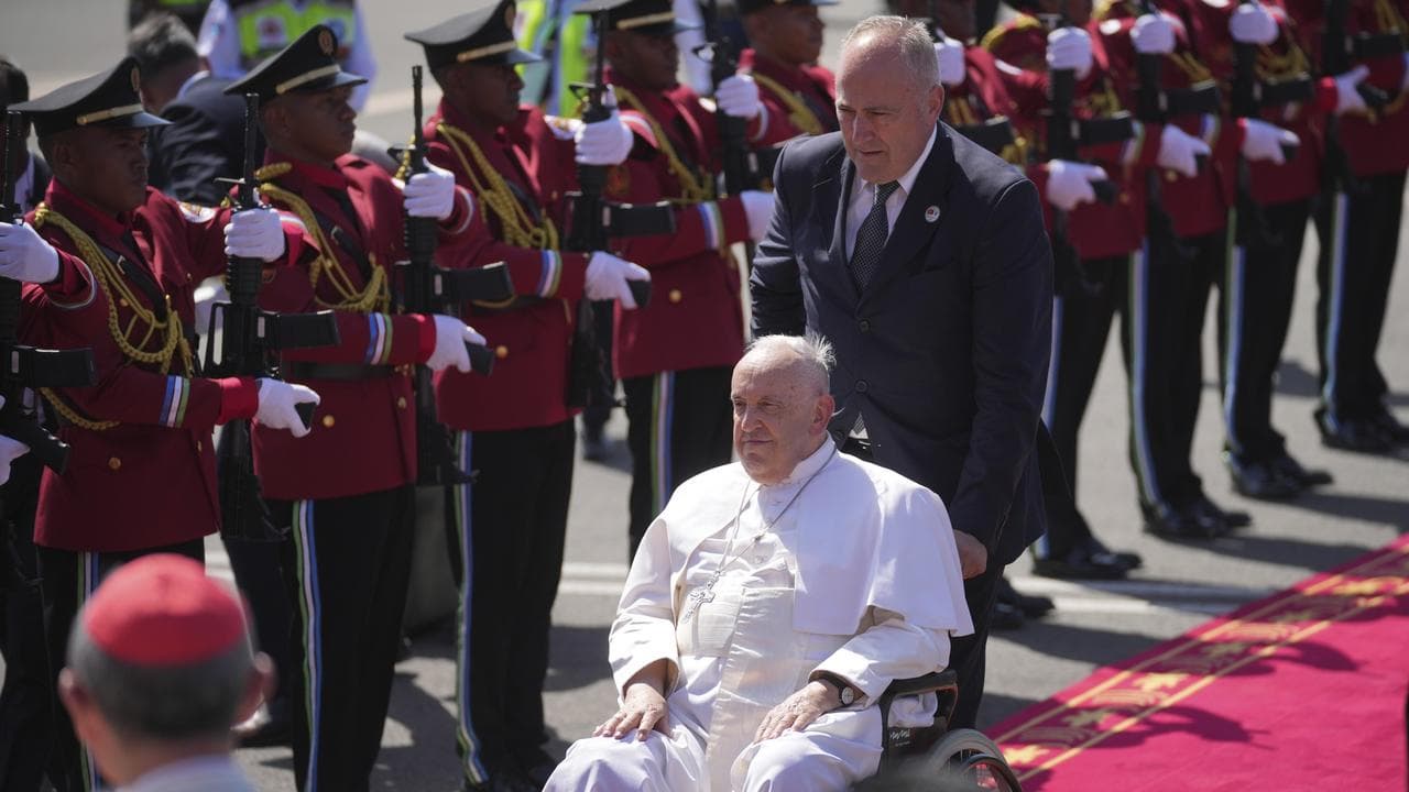 Pope Francis arrives at the international airport in Dili, East Timor
