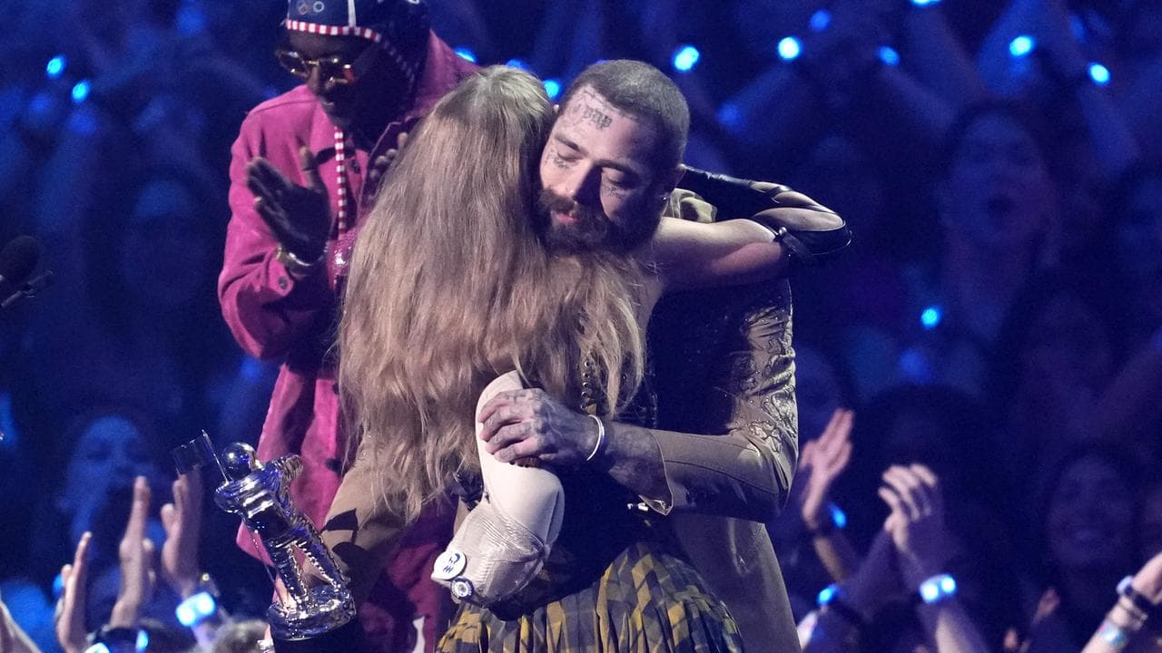 Taylor Swift and Post Malone embrace as they accept VMAs for Fortnight