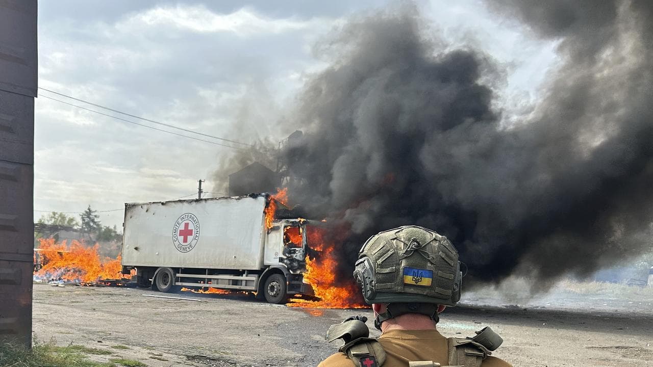Red Cross trucks on fire