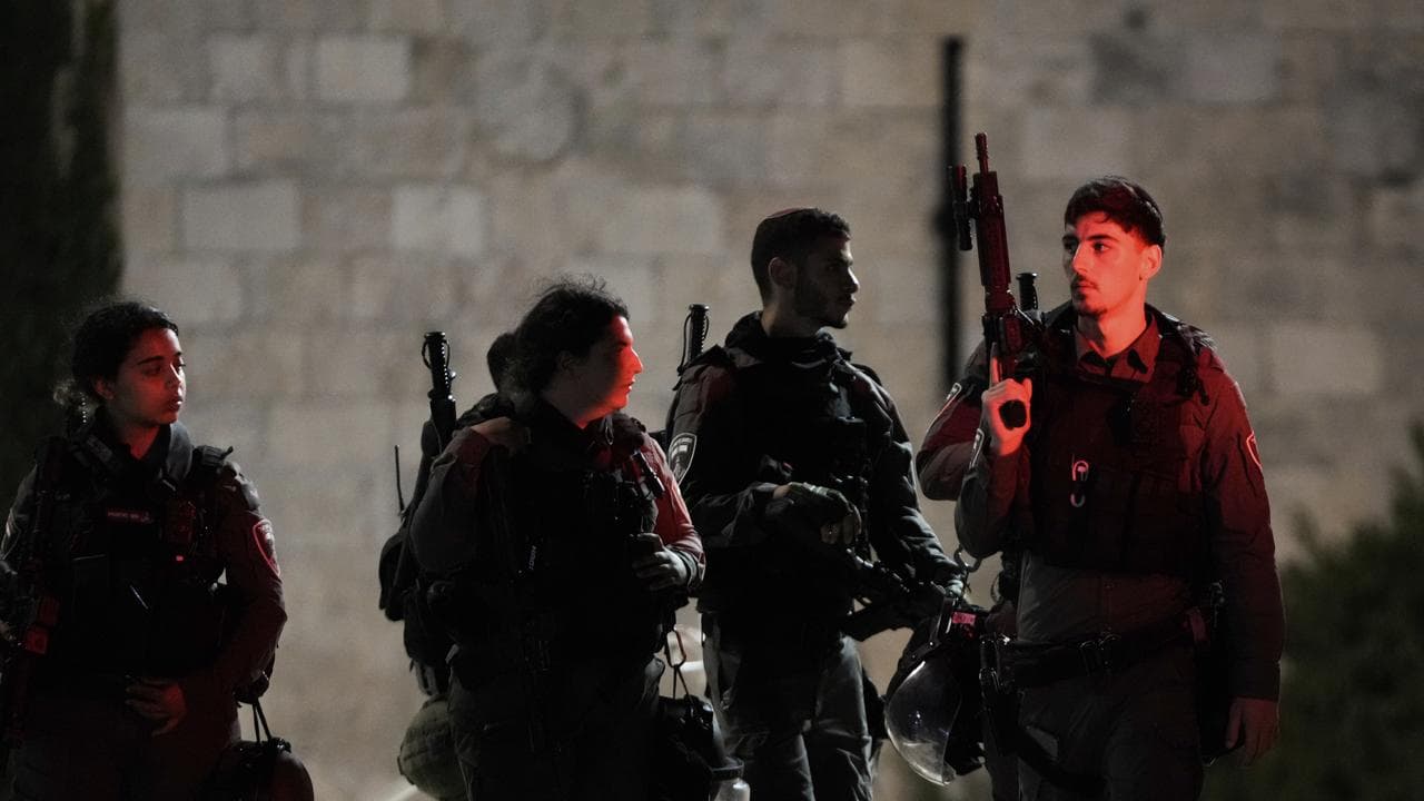 Israeli border police officers stand guard