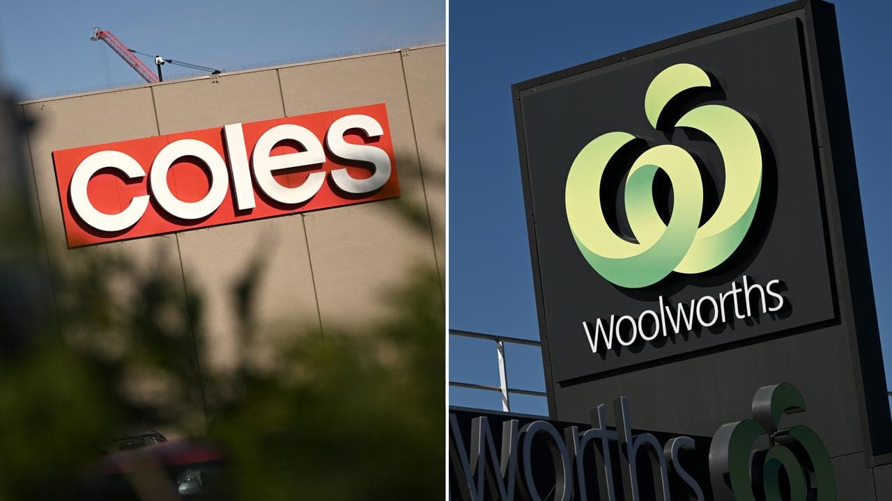 Coles and Woolworths signs.