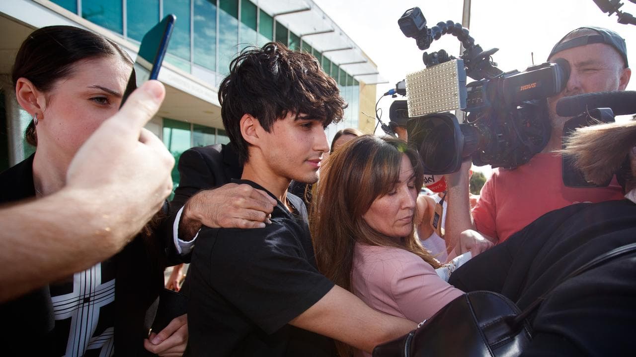 Dhirren Randhawa leaves court led by his mother (file image)