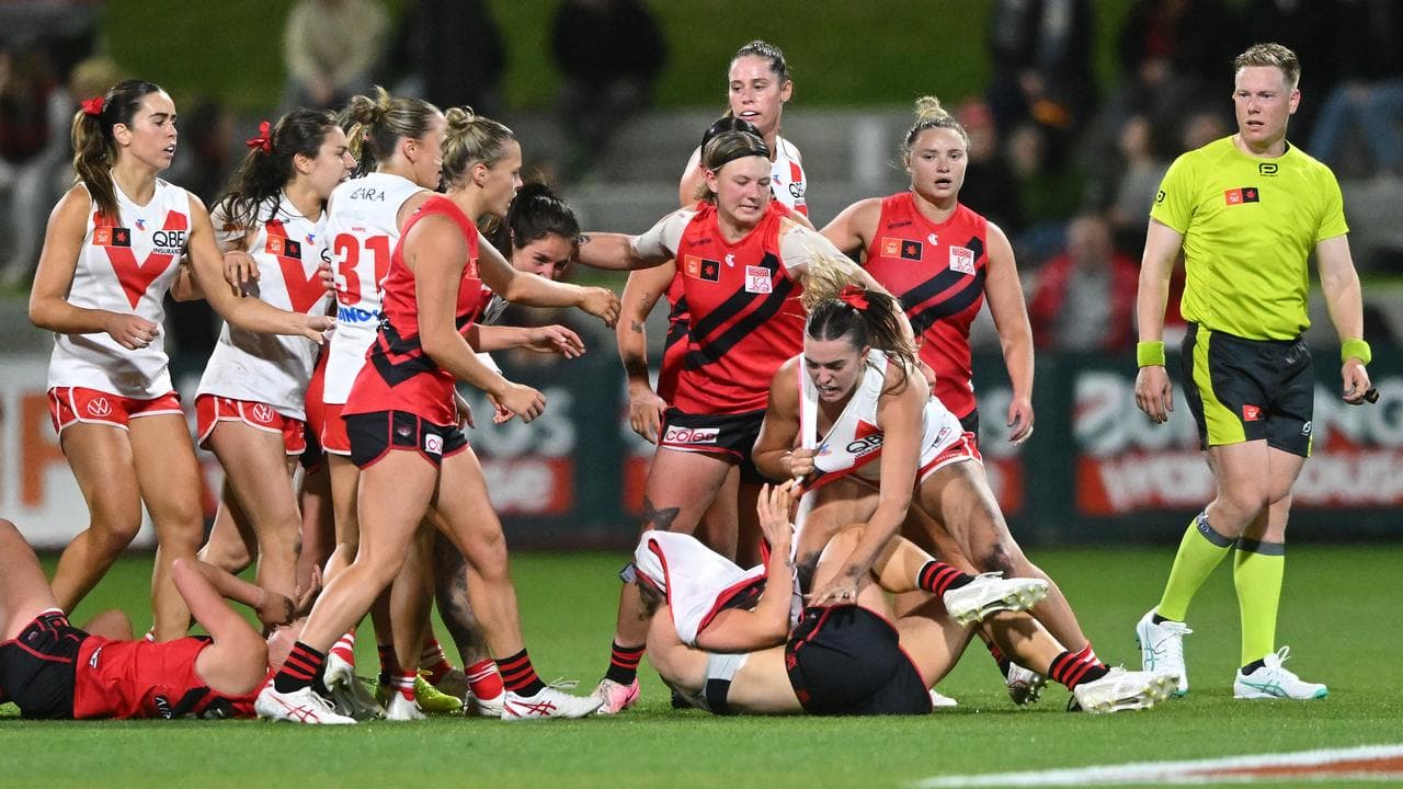 Fighting Essendon and Sydney players.