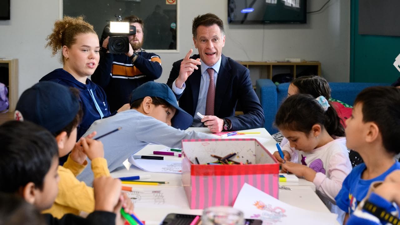 NSW Premier Chris Minns talks to children