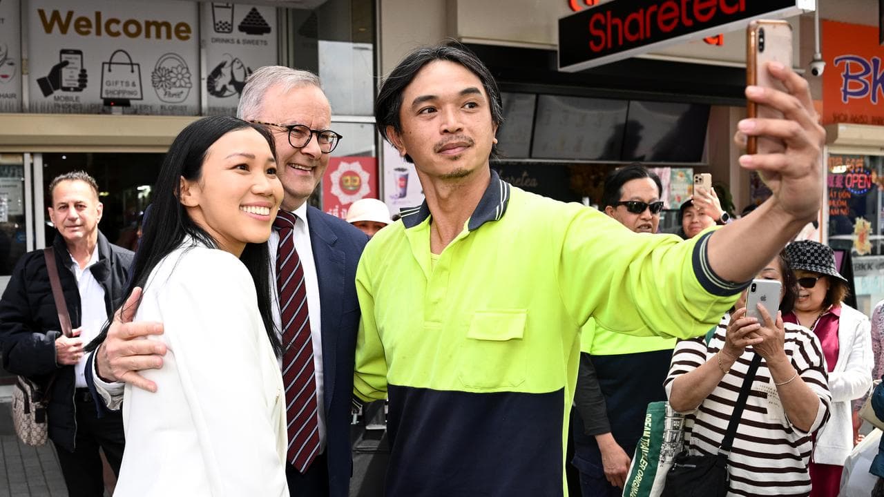 Tu Le and Anthony Albanese with a local resident
