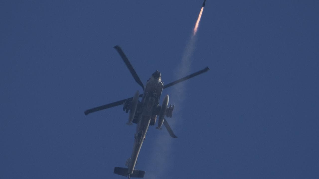 An Israeli Apache helicopter fires a missile towards southern Lebanon