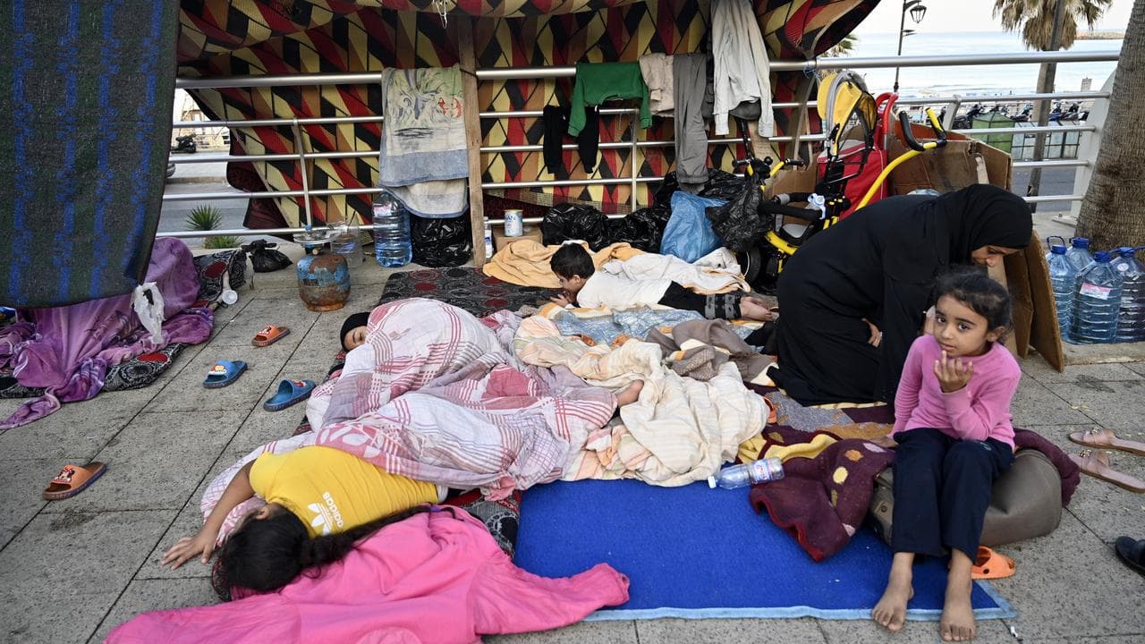 Displaced people set up camp on a street in Beirut, Lebanon