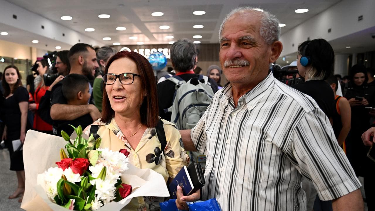 Kanoua Tawk is reunited with her husband Raymond Tawk