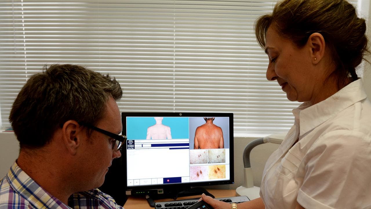 A patient being checked for skin cancer