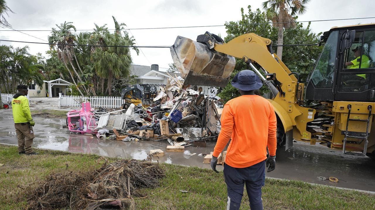 Salvage works remove hurricane debris in Clearwater Beach, Florida